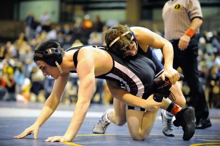 Wrestling match highlighting the ear guards